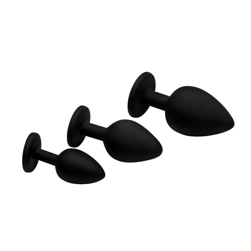 Set of four black silicone butt plugs on a white background
