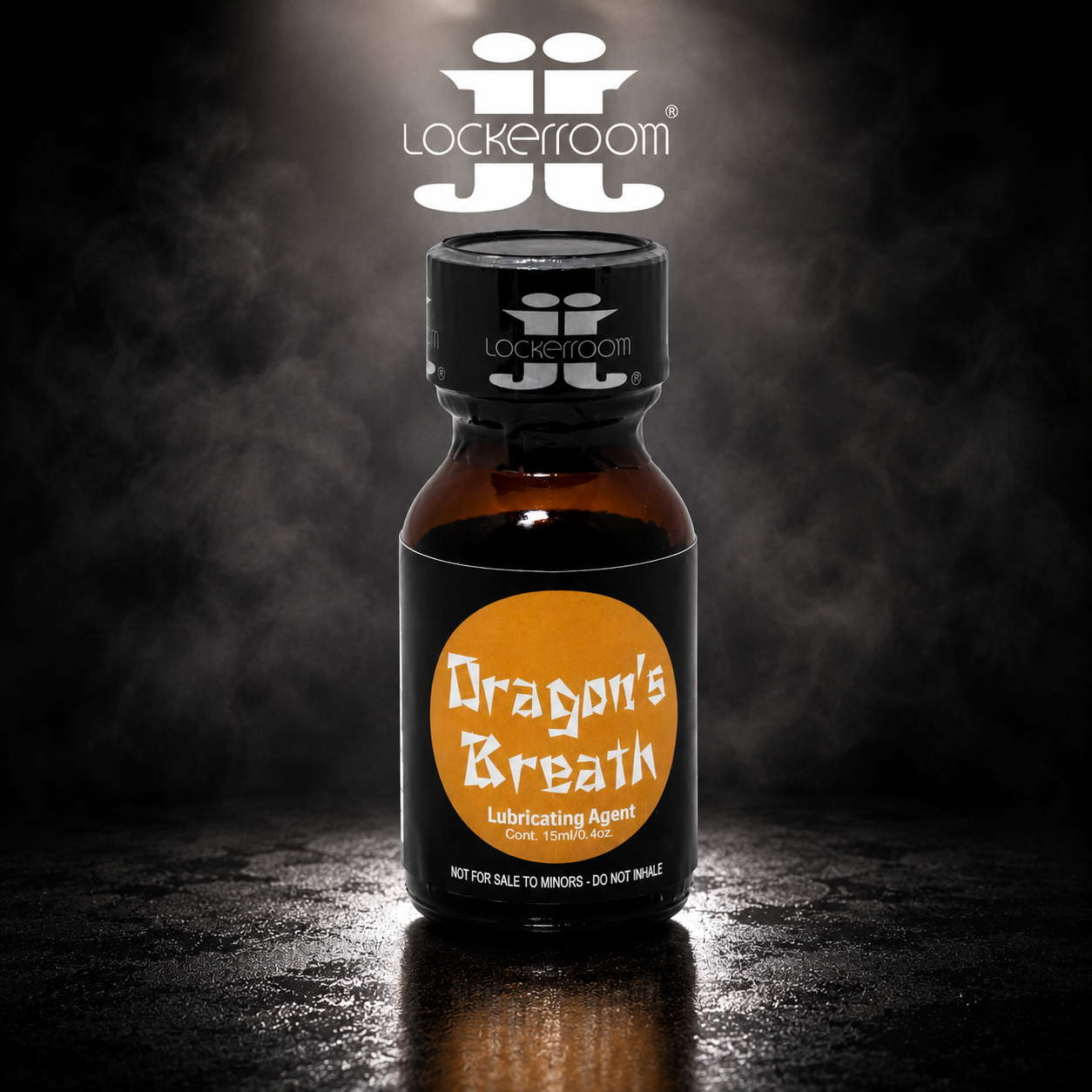A small amber glass bottle with a black cap and black label reading 'Dragon's Breath Lubricating Agent' under a large orange circle, photographed on a dark smoky background with a reflection below. The Lockerroom brand name and logo are visible on the cap and above the bottle.