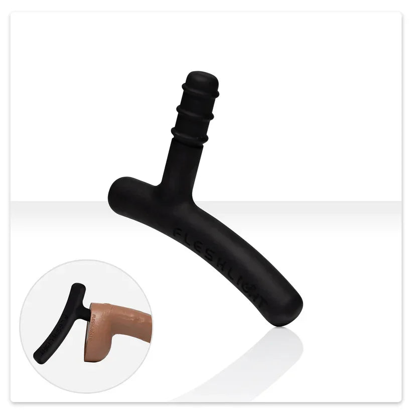 Black and brown plastic component on a white background