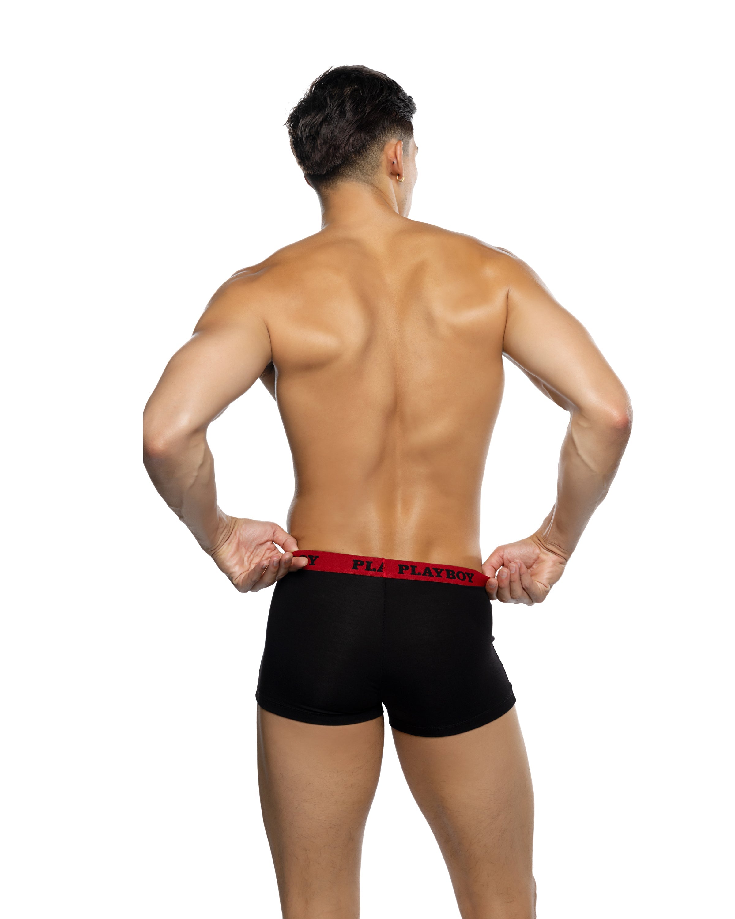 Man wearing black underwear with red waistband on a white background